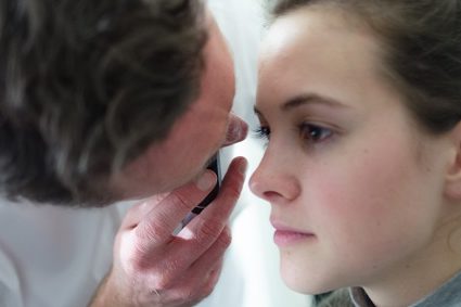Photo of doctor assessing someones eyes